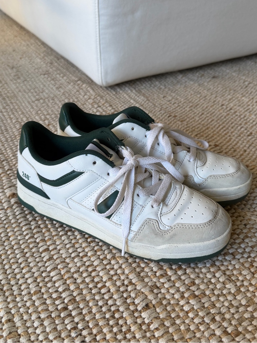 White and green sneakers with stripes